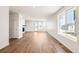 Bright living room with wood-look floors and ample natural light at 9343 Biscay St, Commerce City, CO 80022