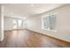 Open and bright living area featuring recessed lighting and wood-look flooring at 9343 Biscay St, Commerce City, CO 80022