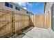Fenced backyard featuring mature landscaping, partial patio, and grassy area at 8915 Field St # 118, Broomfield, CO 80021