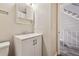 Bathroom vanity features white cabinet, neutral walls, and modern lighting at 8915 Field St # 118, Broomfield, CO 80021
