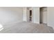 Bedroom boasts neutral walls, gray carpeting, closet, and ample natural light at 8915 Field St # 118, Broomfield, CO 80021