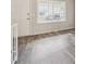 Bright living room boasts modern flooring and natural light at 8915 Field St # 118, Broomfield, CO 80021