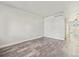 Bright living room with modern flooring, neutral paint, and easy access to other rooms at 8915 Field St # 118, Broomfield, CO 80021