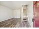 Inviting living room boasts modern flooring and staircase leading to upper level at 8915 Field St # 118, Broomfield, CO 80021