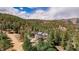 Scenic aerial view of a mountain home with wooded landscape at 37 High View Ln, Boulder, CO 80302