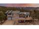 Aerial view showcasing a mountain home with decks and mountain views in the background at 37 High View Ln, Boulder, CO 80302