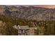 Exterior view of a home nestled in a forest with mountain views at 37 High View Ln, Boulder, CO 80302