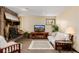 Living room with brick fireplace, mounted television, and white couch at 37 High View Ln, Boulder, CO 80302