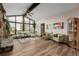 Spacious living room with stone fireplace, hardwood floors and lots of light at 37 High View Ln, Boulder, CO 80302