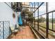 Enclosed outdoor patio with a spiral staircase and seating area at 37 High View Ln, Boulder, CO 80302