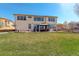 Expansive backyard with a well-maintained lawn, a gazebo, and inviting outdoor seating at 16650 E 107Th Ct, Commerce City, CO 80022