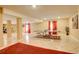 Finished basement space offering a ping pong table, large tiled floors, and ample recreational space at 16650 E 107Th Ct, Commerce City, CO 80022