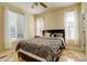 Bedroom with tan walls and decorative bedding at 16650 E 107Th Ct, Commerce City, CO 80022