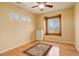 Cozy bedroom with natural light, hardwood floors, and neutral colors at 16650 E 107Th Ct, Commerce City, CO 80022