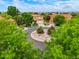 Traditional home boasts a landscaped circular drive and a manicured front lawn at 16650 E 107Th Ct, Commerce City, CO 80022