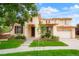 Two-story home boasting lush landscaping, a manicured lawn and a welcoming front porch at 16650 E 107Th Ct, Commerce City, CO 80022