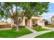 Charming two-story home with a well-manicured lawn and inviting front porch at 16650 E 107Th Ct, Commerce City, CO 80022