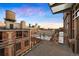 A private balcony offers stunning cityscape views from this urban residence in a renovated brick building at 1890 Wynkoop St # 806, Denver, CO 80202