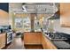 Open kitchen with modern appliances, an island, and exposed ductwork at 1890 Wynkoop St # 806, Denver, CO 80202