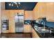 Modern kitchen features stainless steel appliances, granite countertops, and custom cabinetry at 1890 Wynkoop St # 806, Denver, CO 80202