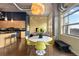 Open concept floor plan with dining area, kitchen, and exposed concrete beams at 1890 Wynkoop St # 806, Denver, CO 80202