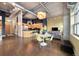 Open-concept living space with a modern kitchen, dining area, and stylish decor with exposed ductwork and concrete ceilings at 1890 Wynkoop St # 806, Denver, CO 80202