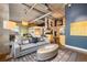 Open-concept living space with an industrial design, featuring hardwood floors and modern furnishings at 1890 Wynkoop St # 806, Denver, CO 80202