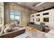Bright living room with balcony, large windows providing city views, and a seating area with comfortable sofas at 1890 Wynkoop St # 806, Denver, CO 80202