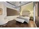 Comfortable main bedroom featuring exposed ductwork and a cushioned headboard at 1890 Wynkoop St # 806, Denver, CO 80202