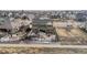 Aerial view of backyard featuring patio with hot tub, outdoor kitchen, and pergola at 20503 E 50Th Pl, Denver, CO 80249