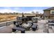 Backyard featuring an outdoor kitchen, gas grill, fire pit, and seating at 20503 E 50Th Pl, Denver, CO 80249