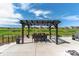 Backyard patio featuring an elegant outdoor dining area and green views at 20503 E 50Th Pl, Denver, CO 80249