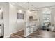 Inviting bar area with seating, pendant lighting, and ample storage for entertaining guests at 20503 E 50Th Pl, Denver, CO 80249