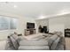 Basement featuring plush sectional and entertainment center at 20503 E 50Th Pl, Denver, CO 80249