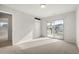 Open bedroom featuring sliding glass doors to a deck with ample natural light at 20503 E 50Th Pl, Denver, CO 80249