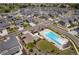 Aerial view of the community pool with lounge chairs and nearby parking area at 20503 E 50Th Pl, Denver, CO 80249