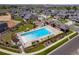 Aerial view of the community pool, lounge chairs, and surrounding landscaping at 20503 E 50Th Pl, Denver, CO 80249