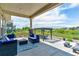 Enjoy the expansive views from this covered patio, furnished with plush outdoor seating and a pergola covered dining area at 20503 E 50Th Pl, Denver, CO 80249