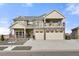 Charming two-story home with a stone facade, front porch, upper balcony, and a spacious three-car garage at 20503 E 50Th Pl, Denver, CO 80249