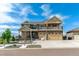 Beautiful two-story home boasts a large three-car garage, balcony, and landscaped front yard at 20503 E 50Th Pl, Denver, CO 80249