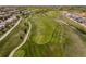 Aerial view of lush green golf course adjacent to a residential community at 20503 E 50Th Pl, Denver, CO 80249