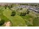 An aerial view shows the meticulously manicured golf course near the residential community at 20503 E 50Th Pl, Denver, CO 80249