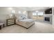 Serene main bedroom featuring a fireplace and sitting area with plenty of natural light at 20503 E 50Th Pl, Denver, CO 80249