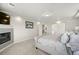 Comfortable main bedroom features a fireplace, plush carpet, and access to bathroom and walk-in closet at 20503 E 50Th Pl, Denver, CO 80249
