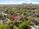 Aerial view of the property showcasing its location, surrounding neighborhood, and city skyline at 3929 Shoshone St, Denver, CO 80211