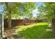 Well-maintained backyard with a wooden fence and large grassy area at 3929 Shoshone St, Denver, CO 80211