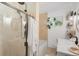 Modern bathroom featuring a walk-in shower, soaking tub, and neutral colors at 3929 Shoshone St, Denver, CO 80211