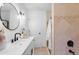 Bright bathroom with a large mirror, modern fixtures, and a walk-in shower at 3929 Shoshone St, Denver, CO 80211