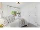 Cozy bedroom offers a comfortable bed, bright window, and neutral decor at 3929 Shoshone St, Denver, CO 80211