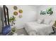 Bright bedroom with a large window, stylish decor, and comfortable furnishings at 3929 Shoshone St, Denver, CO 80211